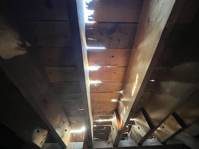 Interior of Timberline Lodge attic showing small holes in roof, following fire. Mt. Hood National Forest