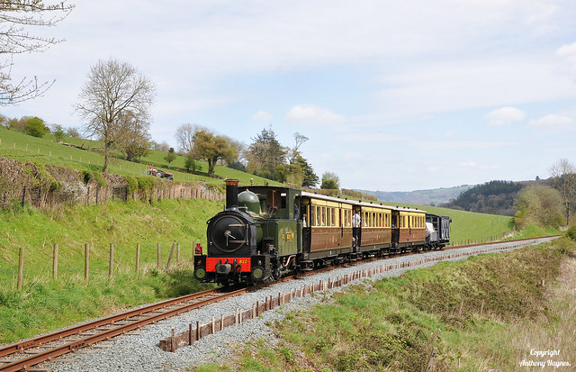 Steam locomotive No. 822 'The Earl' hauls a GWR mixed train towards the the summit of Golfa bank on the Welshpool & Llanfair Light Railway.