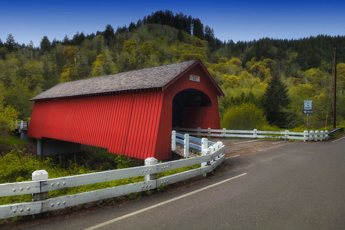 Fisher School Covered Bridge &lt;b&gt;BRIDGE NAME:&lt;/b&gt; Fisher School Covered Bridge
&lt;b&gt;OTHER NAME:&lt;/b&gt; Five Rivers Bridge
&lt;b&gt;COUNTY:&lt;/b&gt; Lincoln
&lt;b&gt;STREAM:&lt;/b&gt; Five Rivers
&lt;b&gt;NEAREST TOWN:&lt;/b&gt; Tidewater
&lt;b&gt;STATUS:&lt;/b&gt; Open to traffic
&lt;b&gt;BRIDGE LENGTH:&lt;/b&gt; 72 Feet
&lt;b&gt;YEAR BUILT:&lt;/b&gt; 1919
&lt;b&gt;ADDED TO NRHP:&lt;/b&gt; November 29, 1979
&lt;b&gt;REBUILT:&lt;/b&gt; 2004
&lt;b&gt;DEDICATED:&lt;/b&gt; 2005

&lt;b&gt;Other Notes:&lt;/b&gt; It was given the Fisher School title because of its location near the Fisher Elementary School, which is no longer standing.
