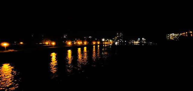 The lights of Strathcona Park, Cummings Bridge, and the east bank of the Rideau River