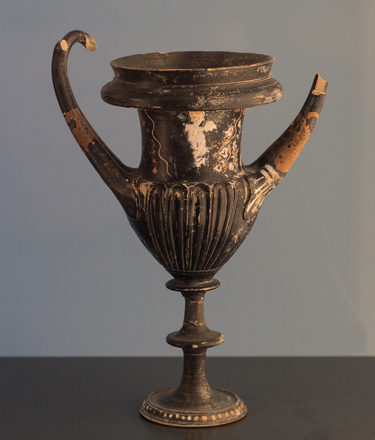 Black Gloss kantharos with superposed decoration of an Eros from Taranto