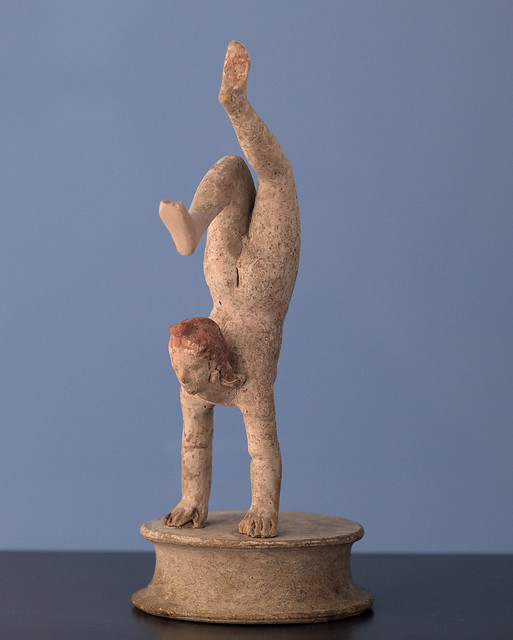 Another Tarentine miniature terracotta acrobat performing a hand-stand