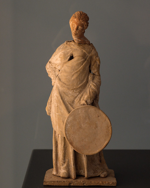 Tarentine polychrome terracotta figurine of a woman with tympanon (frame-drum)