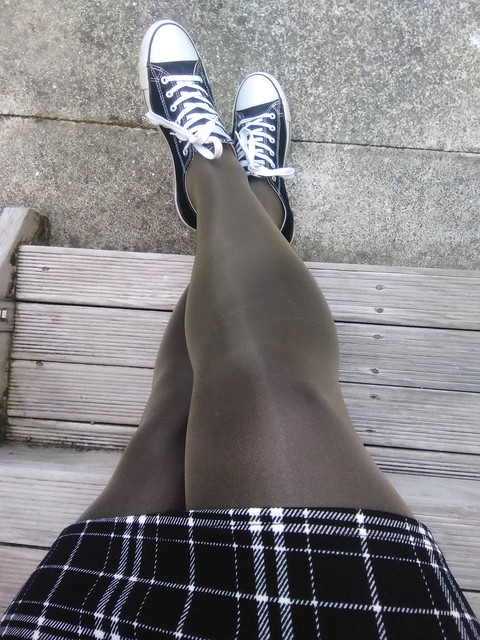 Cute skirt, shiny tights.
