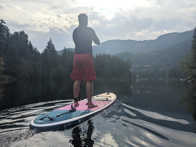 Paddleboarding on a mirror lake