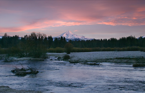 Mt. Jefferson at sunrise with Metolius River, Oregon The Metolius River (pronounced muh TOLL ee us) is a tributary of the Deschutes River (through Lake Billy Chinook) in Central Oregon, near the city of Sisters.  The unincorporated community of Camp Sherman lies astride the southern end of the river. We were staying overnight in Camp Sherman at a great cabin. The name of the river comes from the Warm Springs or Sahaptin word mitula, meaning white salmon and referring to a light colored Chinook salmon.  The Metolius River flows 28.6 miles (46.0 km) from Metolius Springs through the Deschutes National Forest, emptying into Lake Billy Chinook and ultimately the Deschutes River.  We had a great view of Mt. Jefferson covered in snow.