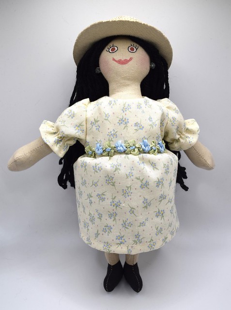 Girl Doll With Black Hair In Ivory Dress