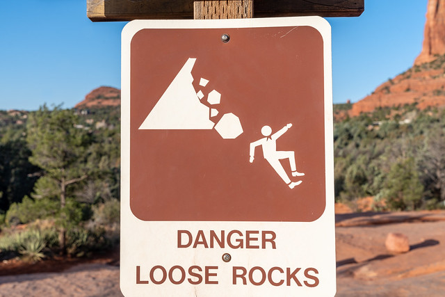 Danger Loose Rocks sign on a hiking trail