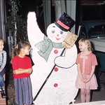 Christmas 1958 Outdoor Decoration My childhood home in Wichita Falls, Texas, decorated for Christmas 1958.

The snowman was made by my parents.  My mom traced it on plywood, and my dad cut it.  Then my mom painted it and added glitter.

My sister, Diane, is the girl in the red standing by the snowman.

As you can tell by the picture, generally we didn&#039;t have a white Christmas.