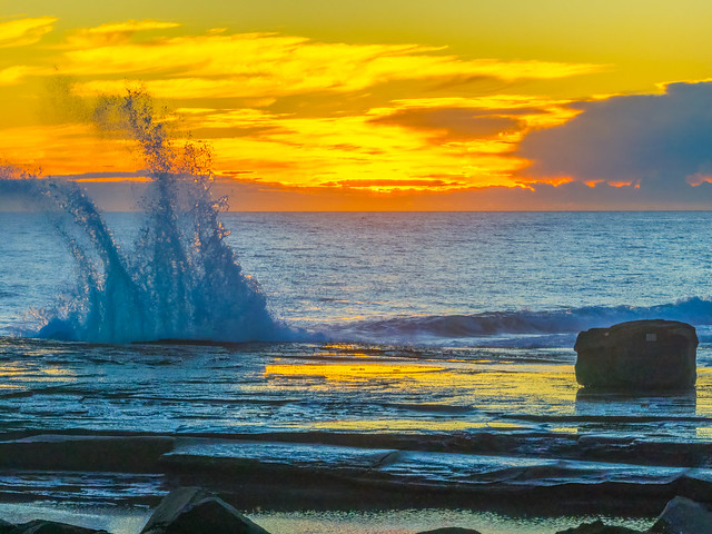 Sunrise over the ocean and rocky Inlet