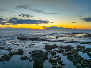 Sunrise over the ocean and rocky Inlet