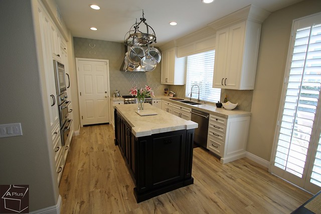 Transitional style #DesignBuild #KitchenRemodel with high-end look custom APlus #cabinetry Hardwood #flooring in Ladera Ranch #OrangeCounty https://www.aplushomeimprovements.com/portfolio_page/125-ladera-ranch-transitional-design-build-kitchen-remodel/