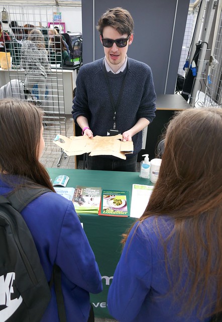 Michael Hands on the Veolia stand at Earthfest 2024 talks to students from Maria Fidelis School