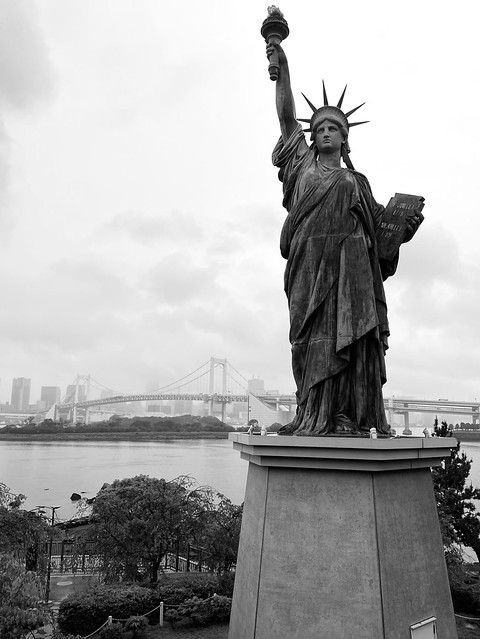 Statue of Liberty and Rainbow Bridge, Tokyo harbour.