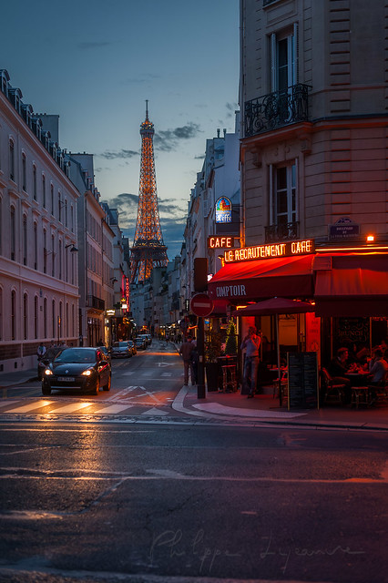 Paris street at dusk with Eiffel tower