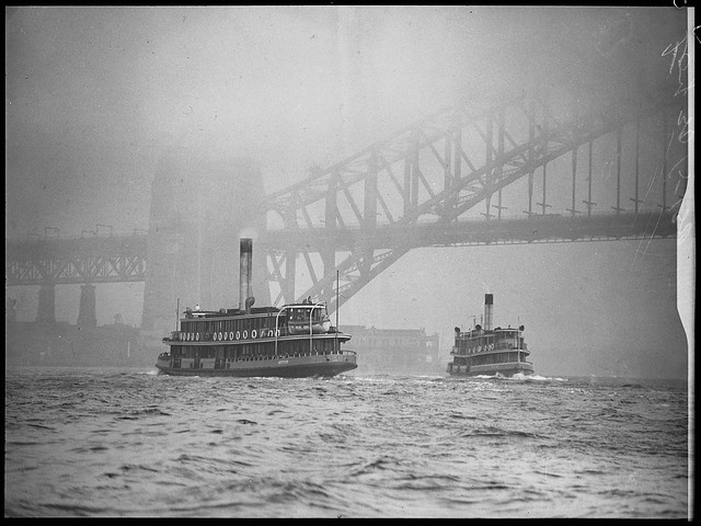 Ferries Kiandra & Kosciusko (both built 1911) in the fog under the Sydney Harbour Bridge, 1939