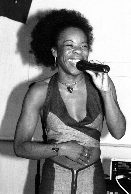 Hostess with the Mostess in Blue Bare Midriff Outfit Exposing Her Navel Jewellery at Singers Open Microphone The Spot Maiden Lane Covent Garden London West End B&W September 2001 007