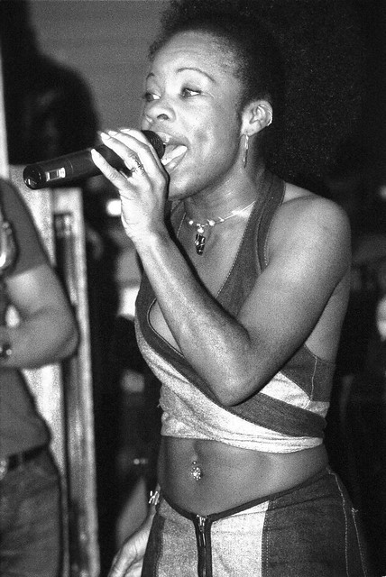Hostess with the Mostess in Blue Bare Midriff Outfit Exposing Her Navel Jewellery at Singers Open Microphone The Spot Maiden Lane Covent Garden London West End B&W September 2001 009