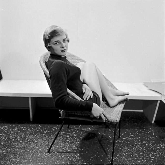 Woman Posing in Wicker Chair, c. 1960