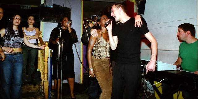 Charming Lady in Animal Skin Print Top and Brown Suede Leather Trousers at Singers Open Microphone with Asha on Keyboard The Spot Maiden Lane Covent Garden London West End September 2001 097w