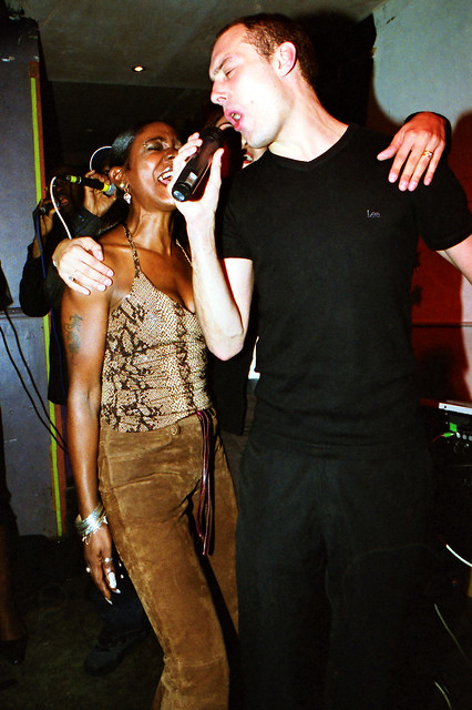 Charming Lady in Animal Skin Print Top and Brown Suede Leather Trousers at Singers Open Microphone with Asha on Keyboard The Spot Maiden Lane Covent Garden London West End September 2001 093v