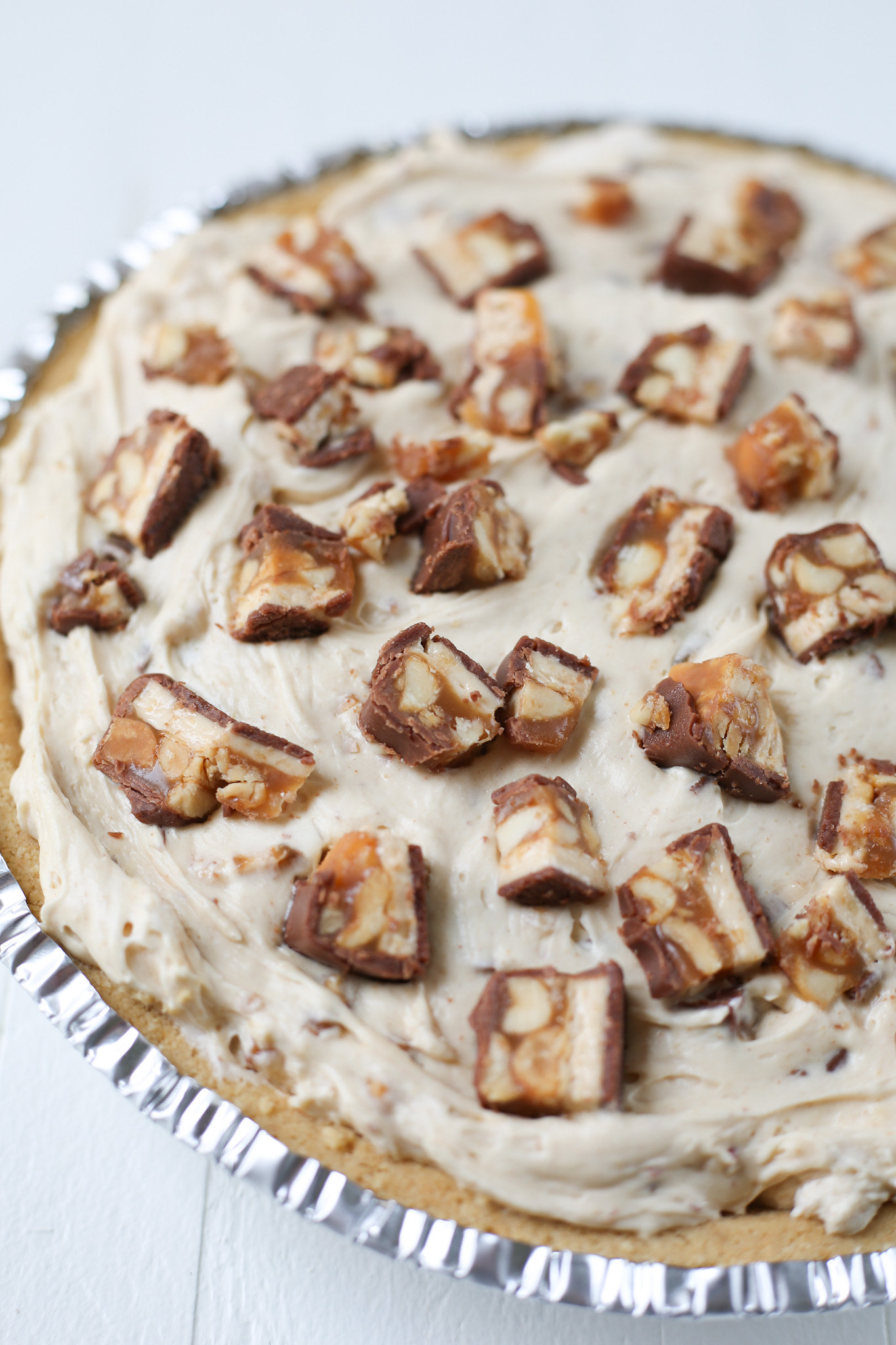 No bake peanut butter pie with chopped Snickers bars
