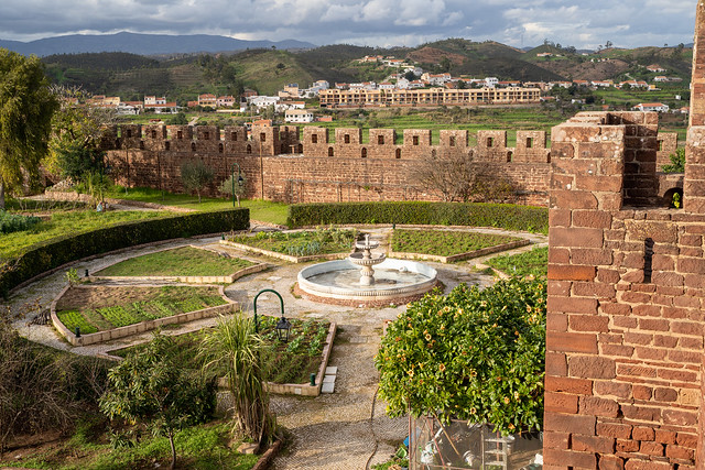 Silves, Portugal - January 23, 2020: View of the interior of the Silves Castle, from up on the castle walls, looking down at the garden courtyard