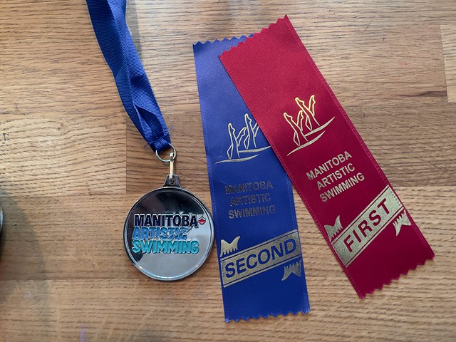 Allow a grandfather to brag a bit. Elli performed with strength and grace at the regional artistic swimming competition in Winnipeg. And the judges thought so too. She earned first place in her age group and her synchro group earned second for their routi
