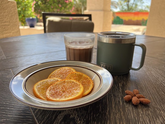 Breakfast. Orange w/Tajin, Almonds, Protein Drink, Coffee.