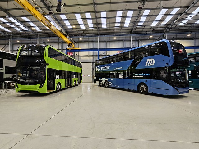 2 Alexander Dennis Enviro 500s at the ADL site in Farnborough,  the green vehicle is to Singapore spec and the blue vehicle is a demonstrator built to KMB Hong Kong spec