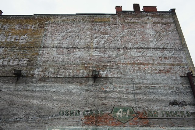 USA Binghamton NY 2024 downtown vintage building with well worn Coca-Cola sign - 