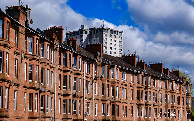 An attractive curve of red sandstone Glasgow tenements in the Cathcart area on the south side of the city.