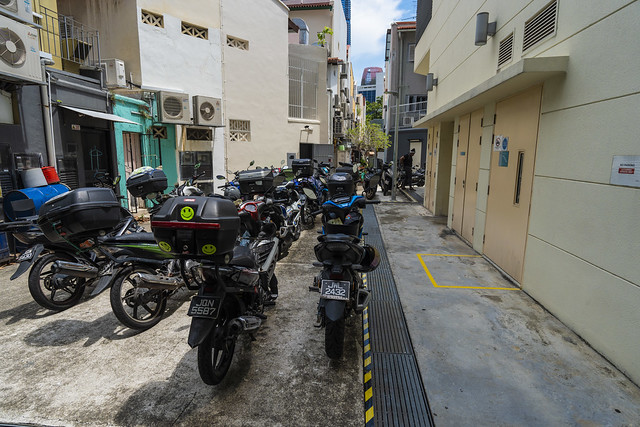 Motorbike parking in a back alley in Singapore