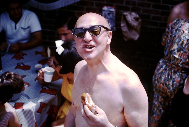 Found Photo - Shirtless Bald Man Eating Sandwich at Pool
