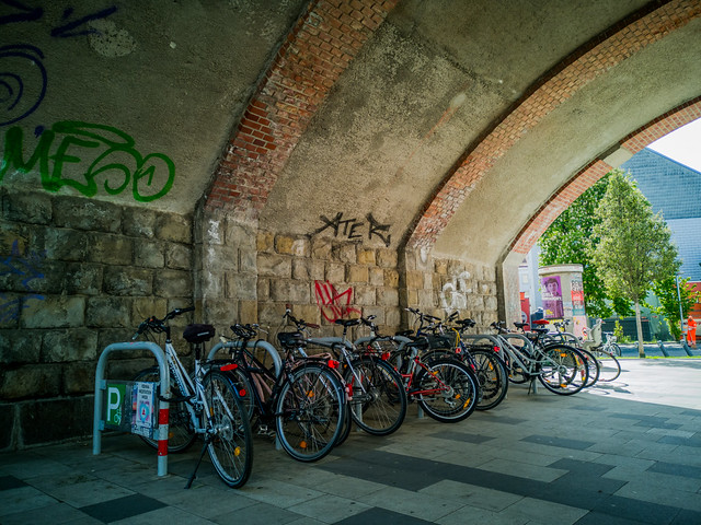 The bicycles under the arch.