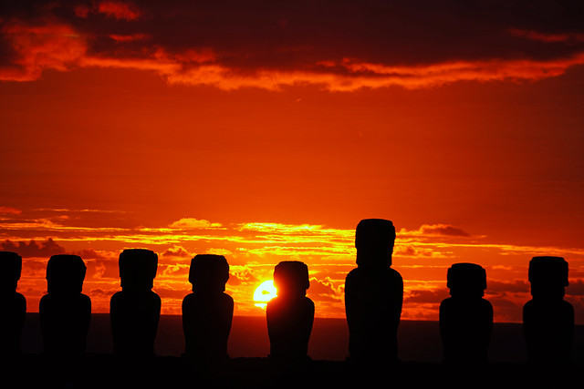 Rising sun behind moai silhouettes, Ahu Tongariki, Easter Island