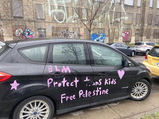 4.29.2024 - “BLM / Protect Trans Kids / Free Palestine” message on car, Minneapolis