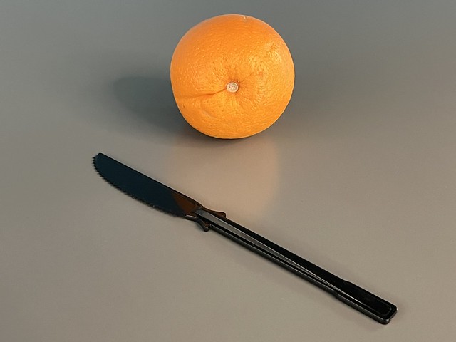 Orange & Plastic Black Knife - Photo Taken by STEVEN CHATEAUNEUF On April 30, 2024