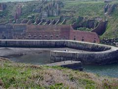 factory ruins in the harbour of the village of Porthgain on the Pembrokeshire Coast Trail of Wales