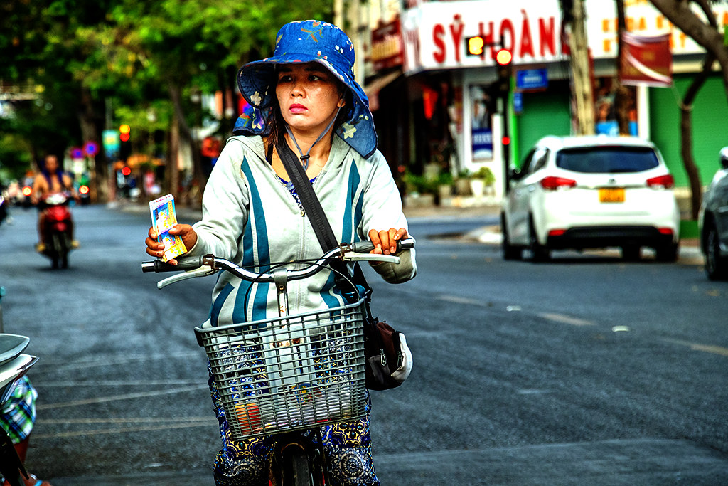 Itinerant seller of lottery tickets on a bicycle on 4-30-24--Vung Tau copy