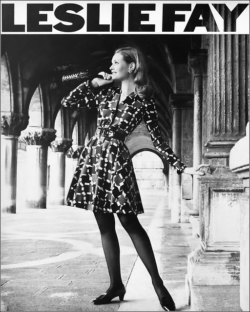 Model in Arnel jersey dress with a graceful, circular skirt in brown/black or navy/green with white by Leslie Fay, photographed in Venice, Harper's Bazaar, May 1969