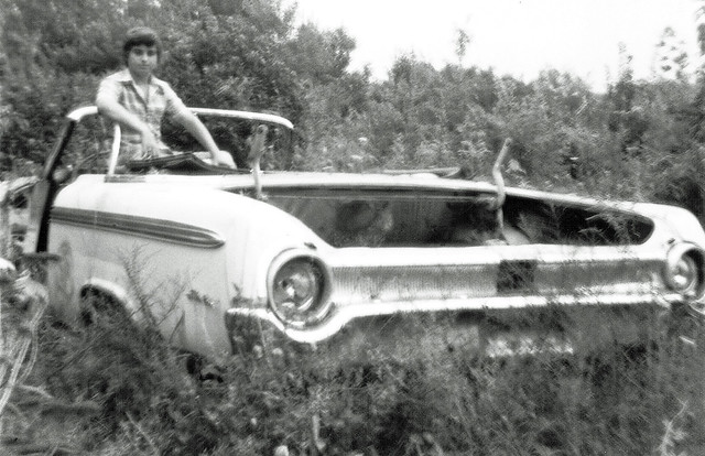 Yours Truly in an abandoned Ford Galaxy dumped in a field at the end of Seabreeze Avenue. Milford CT. Aug 1973