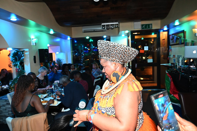 DSC_5044 South African Freedom Day Celebration at Wazobia Nigerian Restaurant Old Kent Road London 27th April 2024 with Busi Mhlanga Cultural Singer in Orange and Leopard Skin Print Outfit with Zulu Beads