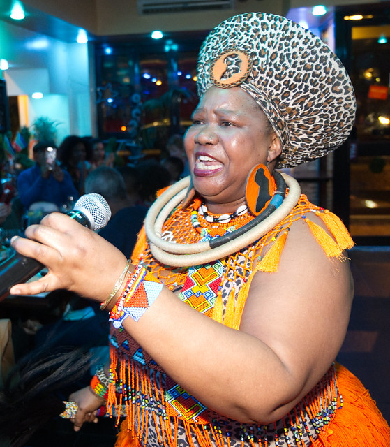 DSC_5042ok South African Freedom Day Celebration at Wazobia Nigerian Restaurant Old Kent Road London 27th April 2024 with Busi Mhlanga Cultural Singer in Orange and Leopard Skin Print Outfit with Zulu Beads