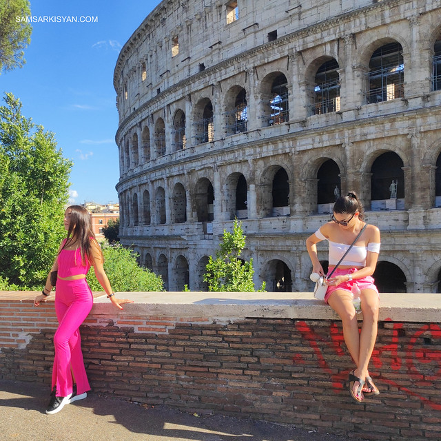 Girls take pictures in front of the Colosseum, Rome