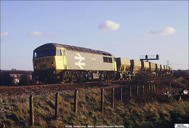 56 038 'Western Mail' drops down north through Nibley with a rake of empty ARC PGA hoppers, slowing for Yate Middle Junction,December 18th 1990