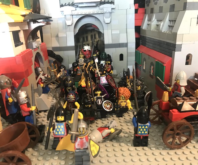 LEGO Classic Castle: the big explosion under the city cracked the walls close to the South eastern main gate and like a swarm of medieval flies the barbarian poor in the south eastern sector of the city knight defenses who where unprepared panic ( AFOL )