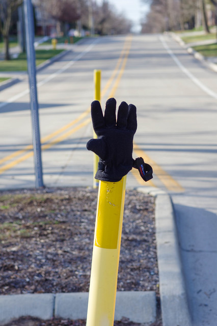 Lost glove on crosswalk post, Oak Street, Birmingham, Michigan. December 2020