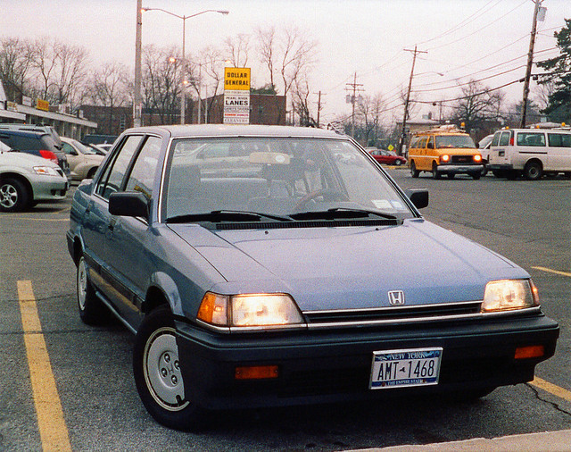 My first Honda - a 1987 Civic. The styling was as plain and utilitarian as it gets, but the car was astonishing dependable. Nov. 1999.