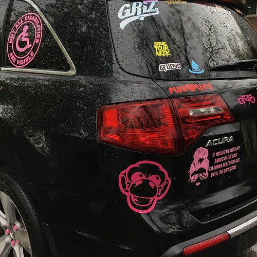 Car personalization in pink, especially There is nothing subtle about this semi-public display of youth culture, unless it is the coded or insider-only references to pop culture unfamiliar to others who fall outside the demographic of the owner/driver.

Press L for lightbox (large) view; click the image or press Z for full image display. 

Hover the mouse pointer over the image for pop-up remarks.